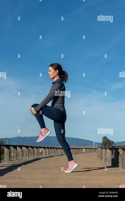 Leg Stretching Exercise Fitness Runner Woman Doing Running Warm Up
