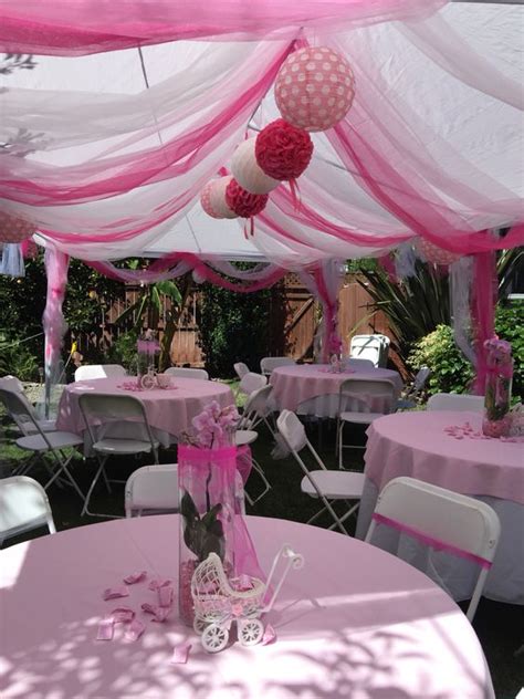 Hang the large cardstock crown from the ceiling just above your tablescape and drape the tulle panels. A Tent for any Event | Lakes Region Tent & Event