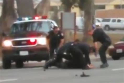 Watch Horrific Moment Police Repeatedly Punch And Kick Suspect As He