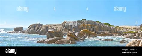 Outdoor Ocean Landscape Of Calm Water And Big Rocks In The Sea