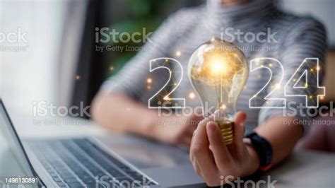 2024 Creative Concept Women Holding Light Bulb 2024 Numbers 2024 Number