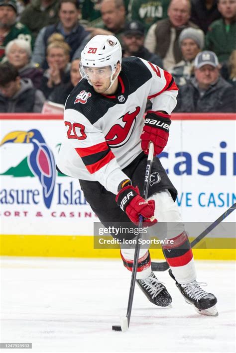 New Jersey Devils Center Michael Mcleod Skates With The Puck During
