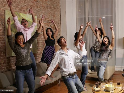 Group Of People Cheering In Room High Res Stock Photo Getty Images