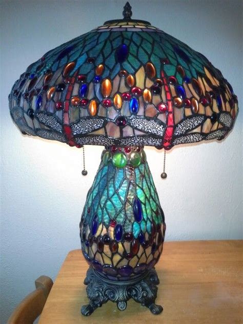 These tiffany lamp shades created by scott riggs tiffanys are of museum quality and provide reflections of the past with a sophisticated elegance and grace which is captured by one of the finest. My mothers day present..... love..... Tiffany inspired ...