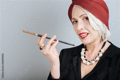 Beautiful Senior Woman Smoking Cigarette Stock Photo And Royalty