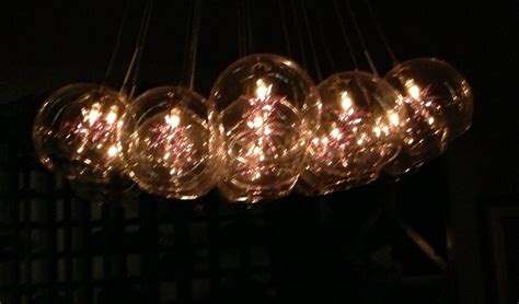 Held in place by a thread. Chandelier that looks like upside down wine glasses ...