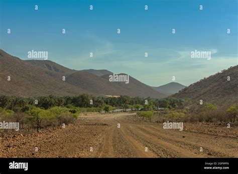 Landscape View Of The Kunene River The Border River Between Namibia