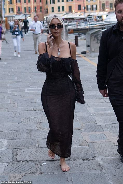 Kim Kardashian Exhibits Her Hourglass Figure In A Tight Black Maxi