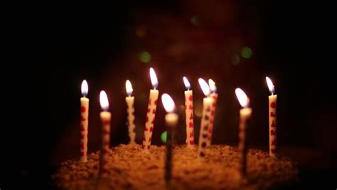 Birthday cake with a burning birthday candle. Blow Out the Candles and Make Your Wishes Known | Central ...