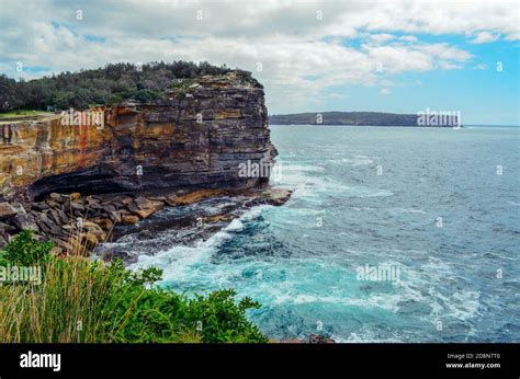 Jagged Rocky Cliffs Facing The Sea Stock Photo Alamy
