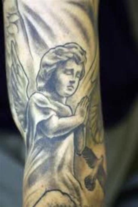 Flying bird with cupid cherub tattoo on man right front shoulder. Cherub Tattoos And Meanings-Cherub Tattoo Designs And ...