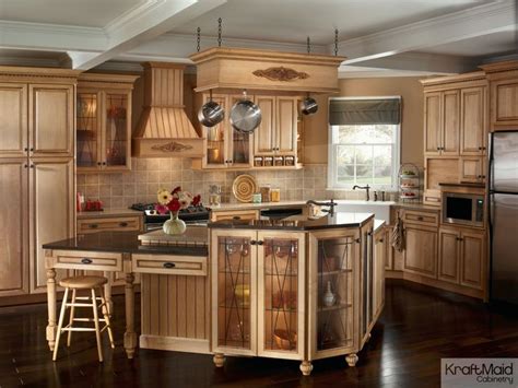 Kraftmaid cabinetry is made to order for each customer. This traditional kitchen with KraftMaid cabinetry and a multi-tiered island provides a balance ...