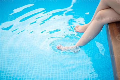 One Woman Soaked Her Feet In The Water Pool Of Her Home Stock Photo At Vecteezy
