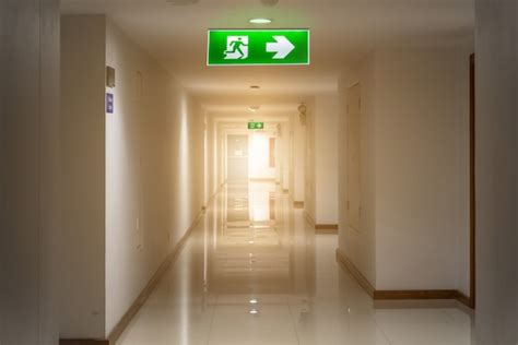 Premium Photo Green Emergency Exit Sign In Hotel Showing The Way To