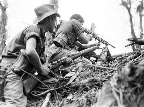 Bren Gun Team Of The 28th Australian Infantry Battalion Supports An