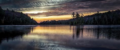 2560x1080 A Calm Lake At Sunset 2560x1080 Resolution