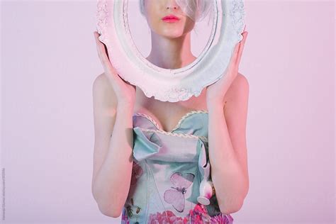 Beautiful Woman In Floral Dress Holding White Oval Frame By Stocksy Contributor Nemanja