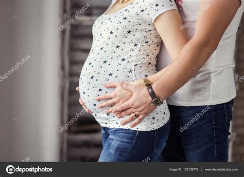 Photo Of Pregnant Woman Belly Hands Hugging Pregnant Belly Close Up