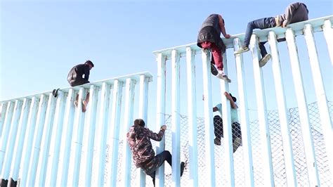 Video Shows Migrants Climbing Us Mexico Border Fence