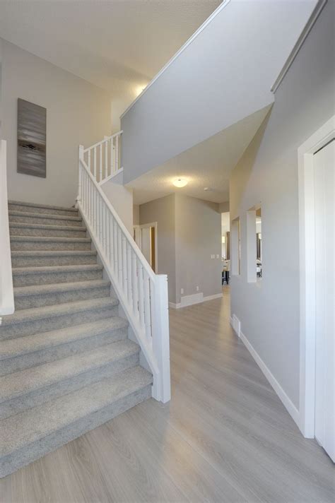 Thank you for giving us the opportunity to bid on your residential & commercial laminate wood flooring needs. The foyer in this home is bright and open. Head up the ...