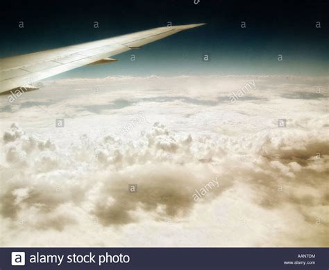 Aircraft Wing Flying Over A Cloudy Sky Stock Photo Alamy