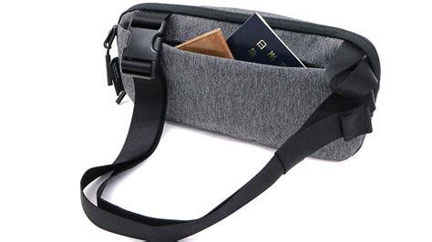 Doesn't fit in the sleeve or the bag. Aer - Day Sling 2