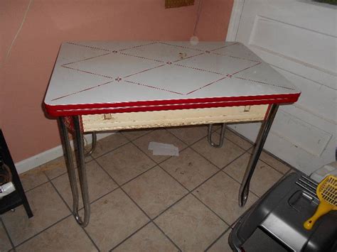 Oak dining room table set * formica top kitchen table w/4 carpet roller chairs & leaf * corner lighted glass hutch w/4 shelves * small glass hutch w/glass shelves * wood bookcase w/glass doors * oak setting. Vintage White W Red Trim Enamel Porcelain Leaf Kitchen Table