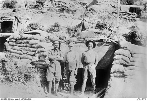 Group Portrait Of Three Soldiers Standing In A Signallers Dugout At