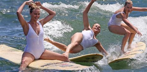 Wipe Out Margot Robbie Takes A Tumble Surfing In See Through White Swimsuit