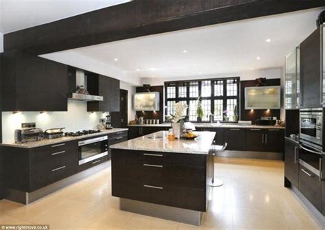 Mark the counter's back edge to center the sink within its cabinet. Price on application: This modern kitchen sits in a ...