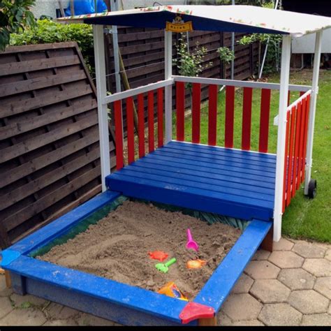 Often, simple little improvements and intentional design decisions will make a huge difference in the appearance of your landscaping. Playhouse and sandbox. Great idea that it's on wheels ...