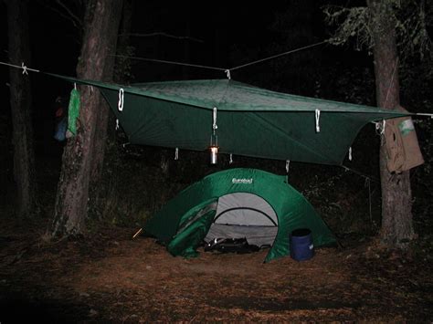 That way, the rain doesn't gather on top of the tarp or roll off and seep under your tent. Tarp over tent | Tent, Outdoor camping, Tarps