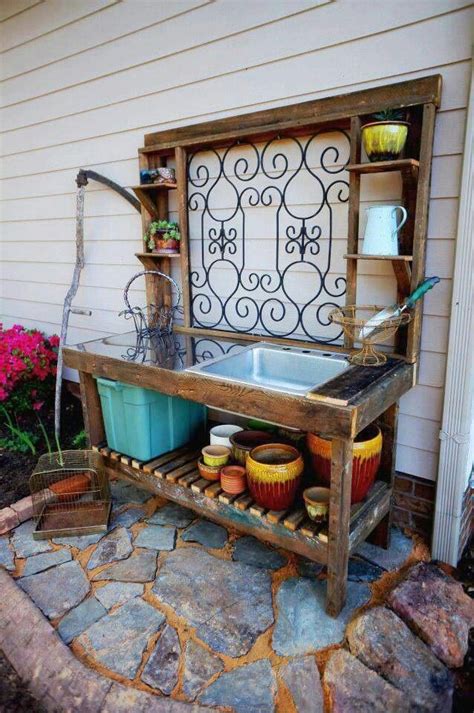 An Outdoor Sink With Pots And Pans On It