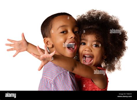 Two Cheerful African American Siblings Sister Hugging Her Brother