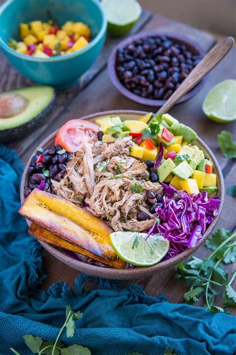 You can easily add a little extra rice to the burrito bowls to make the chicken go even further. Crock Pot Carnitas Burrito Bowls - The Roasted Root