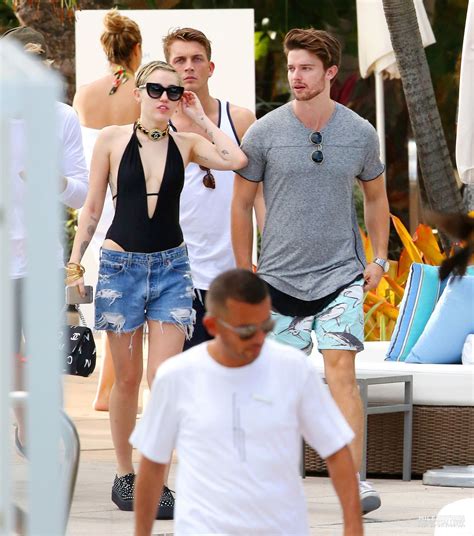 Miley Cyrus At A Pool In Miami With Her Boyfriend December 2014