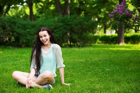 Smiling Beautiful Young Woman Sitting On Grass Stock Photo Image Of