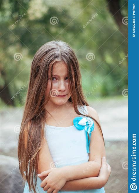 Little Girl With Long Hair Portrait Emotionally Crying And Upset