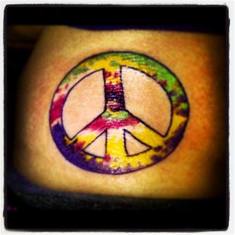A Peace Sign Painted On The Side Of A Womans Stomach