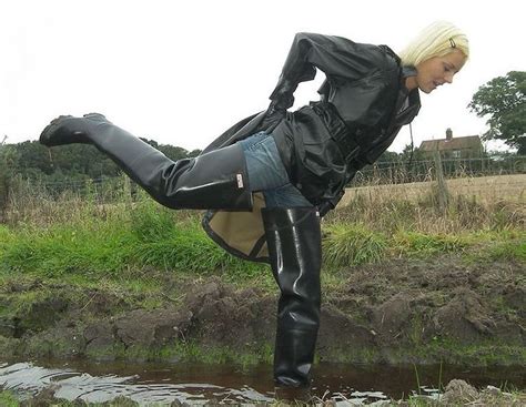 blonde in thigh waders in water gummistiefel regenstiefel reitbekleidung