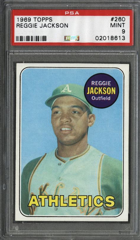 It offers a classic photograph of the young player in his vintage athletics uniform on a classic topps design. Lot Detail - 1969 Topps #260 Reggie Jackson Rookie Card - PSA MINT 9
