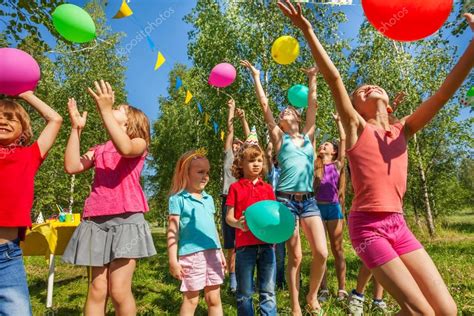 Depositphotos130011136 Stock Photo Kids Playing With Balloons Philo