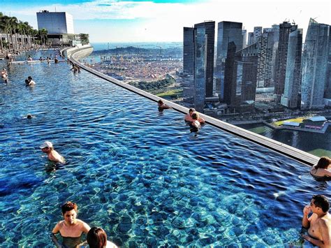 the infinity pool at the marina bay sands hotel in singapore has breathtaking views of the city