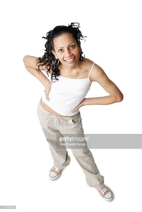 Woman Looking At Camera Smiling Hands On Hip Figure Poses Model