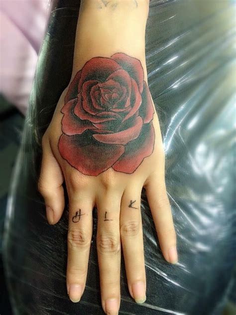 50 Amazing Rose Hand Tattoos Rose Hand Tattoo Red Rose Tattoo Rose