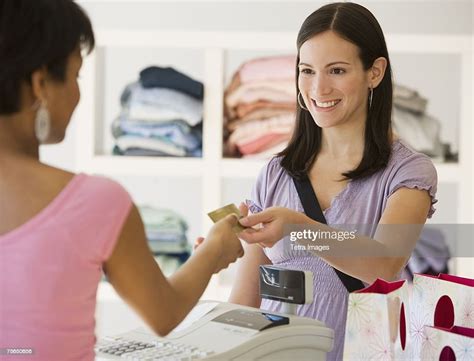 Woman Paying At Clothing Store Photo Getty Images