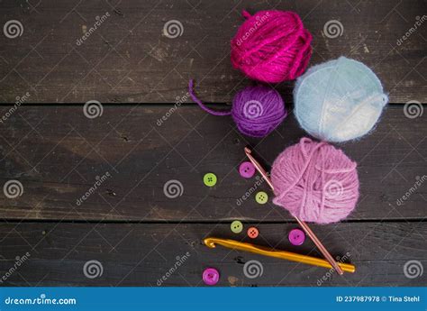 Colorful Woolen Balls On Dark Brown Wooden Ground For Handicrafts With