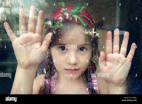 Child Looking Through Window Stock Photo Alamy