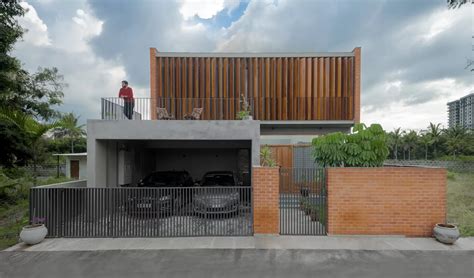 A Courtyard House In Bangalore With Giant Wood Louvers In The Front