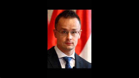 In an office environment, in a suit, with a mobile phone in his hand. Szijjártó Péter Családja : Nepszava A Fidesznel Elso A ...